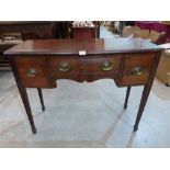 A 19th century small mahogany bowfronted sideboard on square tapered legs with spade terminals.