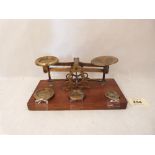 A set of Victorian postal scales with brass weights. Maker: William Mitchell.