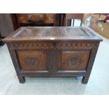 A 17th century small joined oak chest of fine colour, the lid with three fielded panels, over the