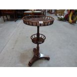 An early Victorian rosewood etagere, with two galleried graduated tiers on a turned down column