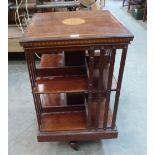 An Edward VII mahogany and inlaid revolving bookcase. 34' high