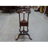 An 18th century mahogany basin stand, the centre stage with a drawer. 32' high