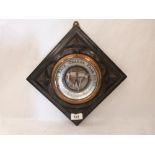 A carved ebonised aneroid barometer. 9' wide