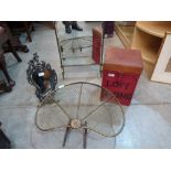 A brass mirror fireguard; a spark guard, a reproduction strut mirror and a tin box stool