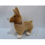 A Merrythough gold and white plush dog. 9¼' high