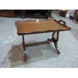 A mahogany tray-top occasional table on lyre trestle supports. 27½' wide