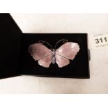 A silver and pink enamel butterfly brooch. 2¾' wide