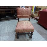 A 17th century style yew wood side chair with upholstered back and seat on turned legs