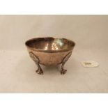 A continental silver planished bowl raised on four shell moulded legs. Marked 830. 4½' diam. 5ozs