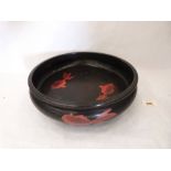 A Japanese bowl, painted with koi carp on a black ground. 11½' diam