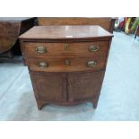 A George III mahogany bowfronted cabinet enclosed by a pair of doors under a deep drawer, on bracket