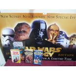 A Star Wars placard and books