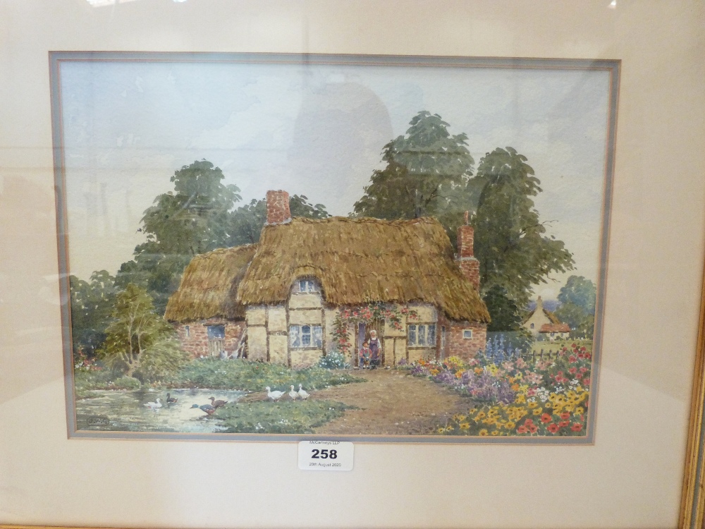 JOHN W. GOUGH BRITISH 20th CENTURY. A cottage garden with figures. Signed initials. Watercolour