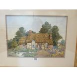 JOHN W. GOUGH BRITISH 20th CENTURY. A cottage garden with figures. Signed initials. Watercolour