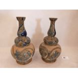 A pair of Doulton Lambeth stoneware truncated vases. Signed with monogram SLJ. Dated 1877. 8¾' high