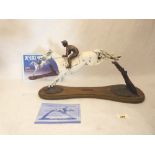 A sculpture by Jonathan Knight, Desert Orchid Jumping for Fun. Limited edition No. 7/275. With