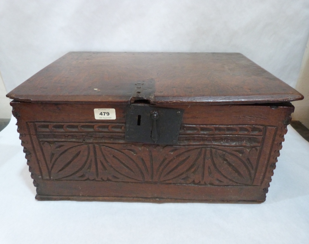 A 17th century small oak chip and scratch carved chest, the interior with a till. 21' wide