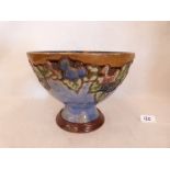 A Royal Doulton stoneware footed bowl, tube line decorated with vine fruits. 9' diam