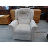 A reclining upholstered armchair