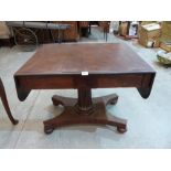 A William IV mahogany sofa table, on fluted tapered column, quadripartite base and bun feet. 34'