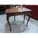 A George III mahogany dropleaf side table with frieze drawer on cabriole legs. 31½' wide. Dropleaf