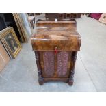 A fine Victorian burr walnut line inlaid and marquetry davenport, the piano lid revealing a fitted
