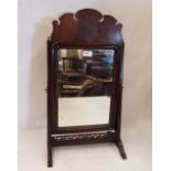 A George III style fret carved mahogany dressing table mirror. 24' high