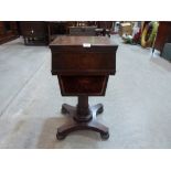 An early Victorian rosewood work table with fitted interior and sliding well, on octagonal truncated