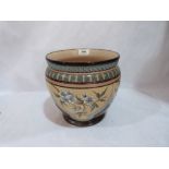 A Doulton Lambeth jardiniere, decorated by Eliza Simmance with flowering prunus in reserves. Signed,