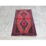 A Balochi rug. 1.35m x 0.8m