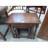 A nest of three oak occasional tables