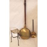 A brass warming pan, a skillet and a footman