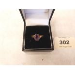 An Edwardian 9ct amethyst ring. Size O. 2.7g gross