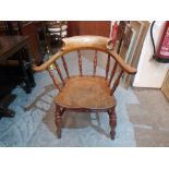 A Victorian smoker's bow elbow chair