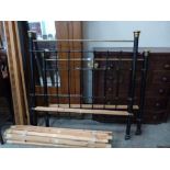 A Victorian 4'6' brass and iron bedstead with irons and wood slats