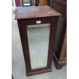 A mahogany bedside cupboard enclosed by a mirror door. 36' high