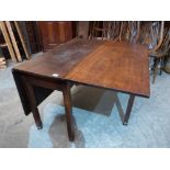 A 19th century mahogany dropleaf dining table on square legs. 42' wide