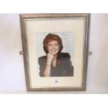 An autographed and inscribed photograph of Cilla Black. Framed