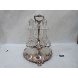 A plated decanter stand with three cut glass mallet decanters, the stand moulded with vine fruits,