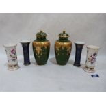 A pair of Limoges inverted baluster jars and covers (one chipped) 8½' high; a pair of German