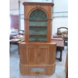 A pine standing corner cupboard, the open niche top over a pair of panel doors and a drawer. 87'