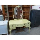 A painted bow-breakfronted dressing table on cabriole legs. 44' wide