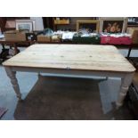 A Victorian pine scrub-top kitchen table on painted turned legs. 66' long