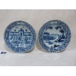 A pair of Dutch Delft blue and white decorated tin glazed earthenware plates, painted with scenes