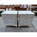 A pair of painted three drawer bedside chests