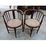 A pair of early 20th century inlaid tub chairs