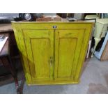 A painted hanging corner cupboard. 37' high