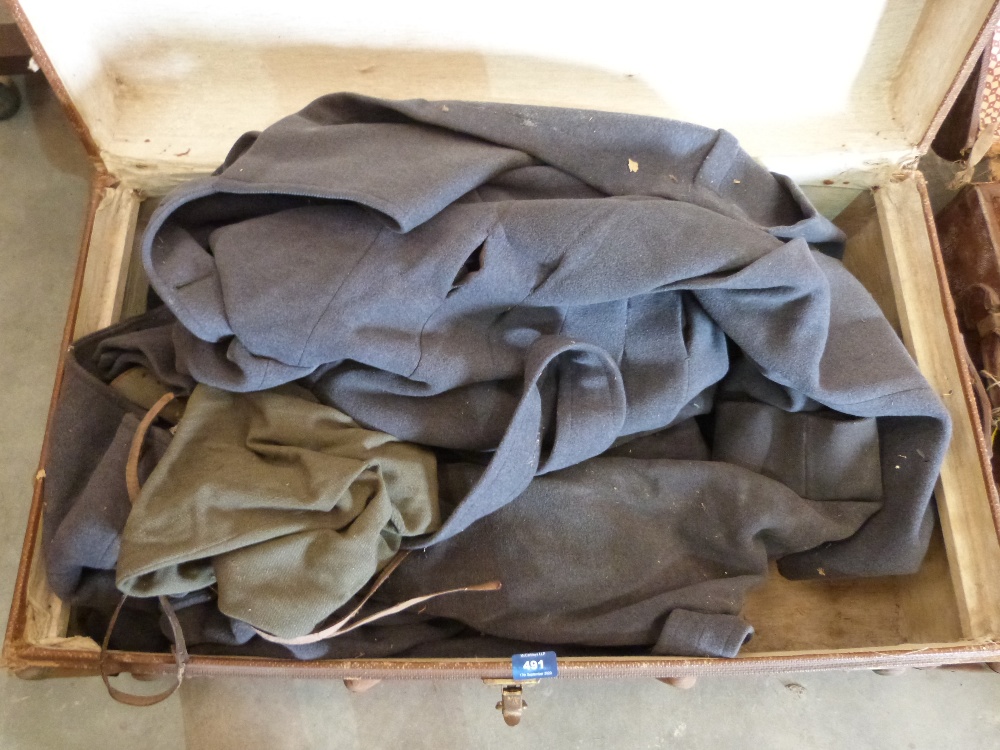 A case of military coats etc. and a case of linen