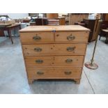 A 19th century pine chest of two short over three long drawers on bracket feet. 36' wide