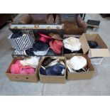 A large quantity of lady's hats, the lot to include a tin cabin trunk